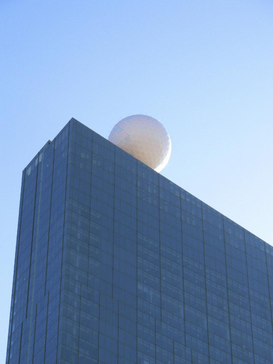 The giant ball atop the soon-to-open Revel casino in Atlantic City, N.J. is fully illuminated for the first time on Wednesday, March 7, 2012. Mitch Gorshin, whose father Frank played "The Riddler" on the "Batman" TV series, says the ball is a constantly changing piece of artwork that will define the identity of the $2.4 billion resort, due to open on April 2. (AP Photo/Wayne Parry)