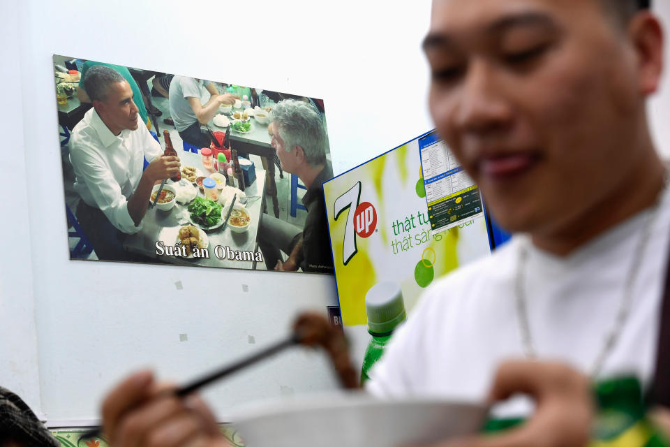 In this photograph taken on March 20, 2018, a customer enjoys a meal at Bun Cha Huong Lien restaurant, now dubbed