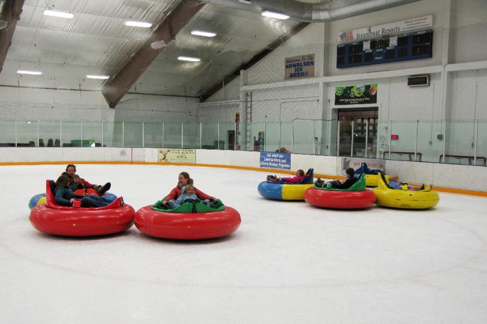 This Dec. 26, 2012 photo shows bumper cars on ice at Howelsen Ice Arena in Steamboat Springs, Colo. The activity is one of a number of relatively new diversions being offered in winter recreation destinations, along with airboarding, snow bikes and snowkiting. (AP Photo/Karen Schwartz)
