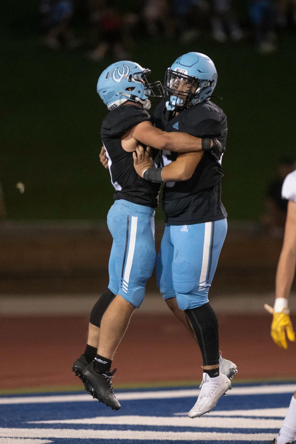 Pueblo West's Jacob Trader, left, and Jaydon Ortiz celebrate after Trader scored a touchdown during the 20th annual Pigskin Classic game at the Colorado State University Pueblo ThunderBowl on Friday, September 2, 2022.