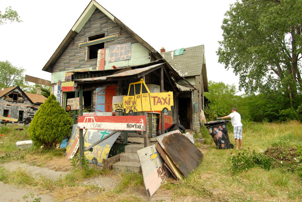 DETROIT, MI - JUNE 16: Volunteers help clean up abandoned homes as part of the Foster the People, Foster the Future: Do Good Project at Heidelberg Project on June 16, 2012 in Detroit, Michigan. (Photo by Paul Warner/Getty Images)