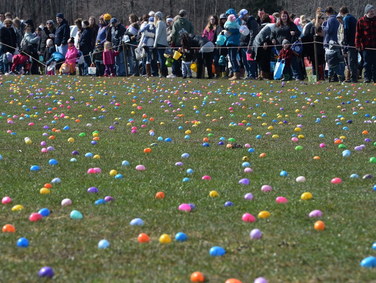 Families wait to begin a past Easter egg hunt at Burch Farms in North East Township.