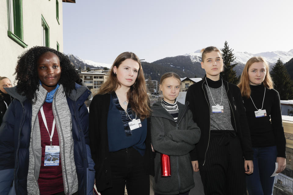 Climate activist Vanessa Nakate, Luisa Neubauer, Greta Thunberg, Isabelle Axelsson and Loukina Tille, from left, arrive for a news conference in Davos, Switzerland, Friday, Jan. 24, 2020. The 50th annual meeting of the forum is taking place in Davos from Jan. 21 until Jan. 24, 2020 (AP Photo/Markus Schreiber)