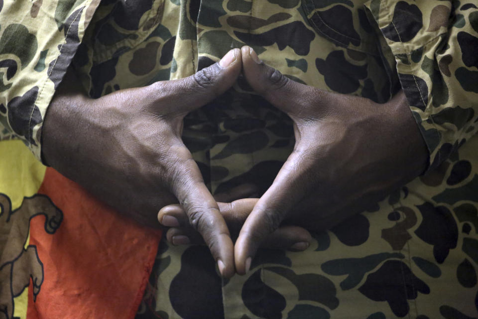 A Rastafari attendee makes a hand gesture symbolizing the Star of David during an event by the Rastafari Coalition marking the 91st anniversary of the coronation of the late Ethiopian Emperor Haile Selassie I in Columbus, Ohio on Tuesday, Nov. 2, 2021. (AP Photo/Emily Leshner)