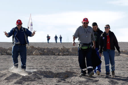 Workers from BHP Billiton's Escondida, the world's biggest copper mine, gather outside the company gates during a strike, in Antofagasta, Chile February 9, 2017. REUTERS/Juan Ricardo