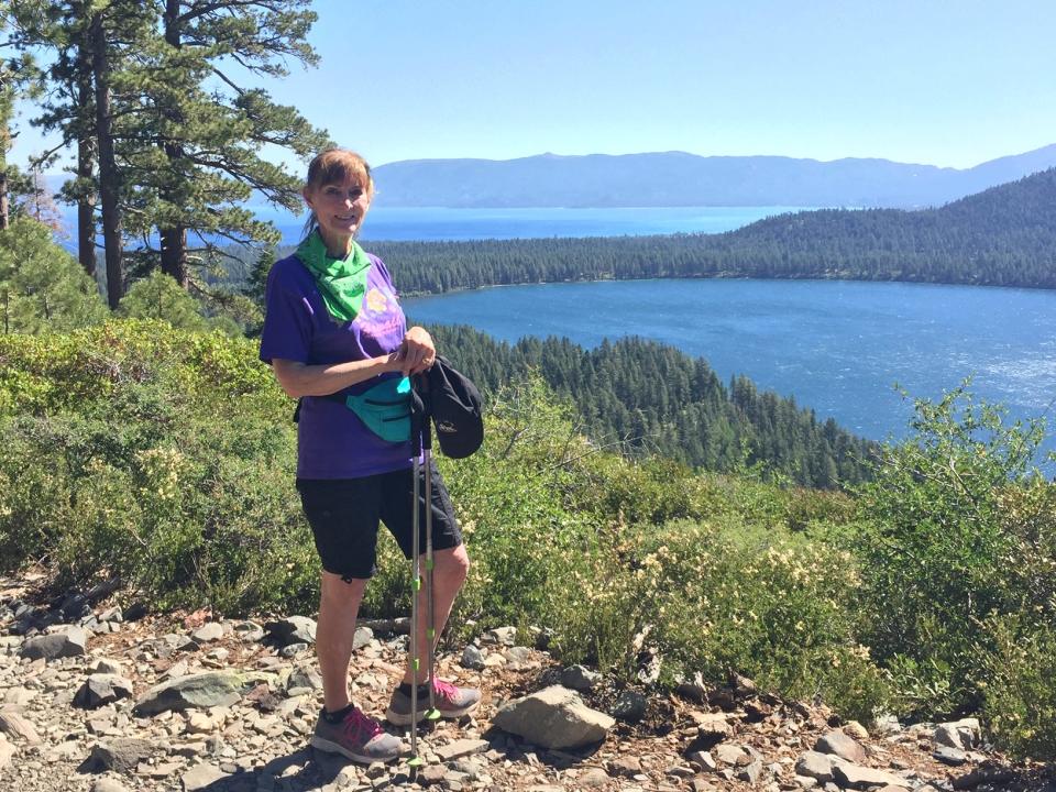 My wife Susan hiking on Mount Tallac Trail with Fallen Leaf Lake and Tahoe in distance.