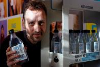 Ecover's Innovation Manager Domen poses with a bottle of dishwasher soap at the factory in Malle