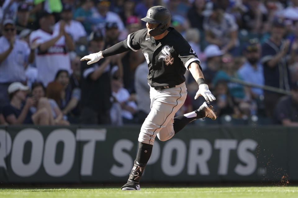 Chicago White Sox's AJ Pollock reacts as he rounds the bases after hitting a solo home run against the Seattle Mariners during the second inning of a baseball game, Monday, Sept. 5, 2022, in Seattle. (AP Photo/Ted S. Warren)