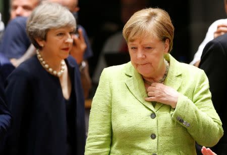 British Prime Minister Theresa May and German Chancellor Angela Merkel attend the EU summit in Brussels, Belgium, June 22, 2017. REUTERS/Francois Lenoir