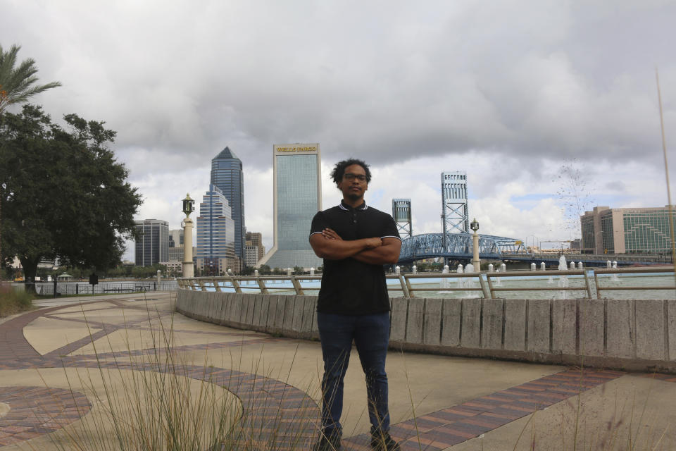 Michael Sampson poses for photo at Friendship Fountain in Jacksonville, Fla., on Friday, Oct. 23, 2020. Sampson cofounded the Jacksonville Community Action Committee to help drive change in a city emerging from its Confederate past. (AP Photo/Bobby Caina Calvan)