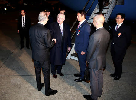 U.S. Secretary of State Rex Tillerson, front second left, is welcomed as he arrives during his first trip to Asia as Secretary, at Haneda International Airport in Tokyo, Wednesday, March 15, 2017. REUTERS/Eugene Hoshiko/Pool