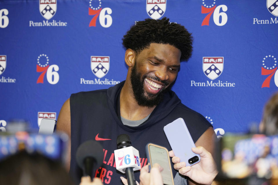 Philadelphia 76ers center Joel Embiid jokes with reporters during an NBA basketball availability Thursday, Oct. 5, 2023, in Fort Collins, Colo. (AP Photo/David Zalubowski)