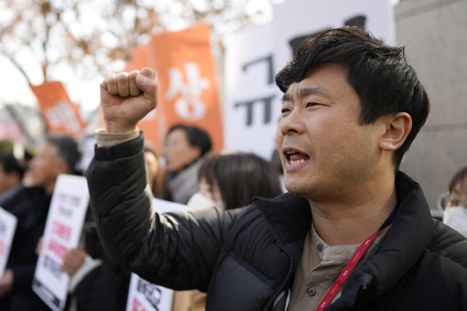 A member of civic group shouts slogan during a rally against the South Korean government's announcement of a plan over the issue of compensation for forced labors, in front of the Foreign Ministry in Seoul, South Korea, Monday, March 6, 2023. South Korea on Monday announced a contentious plan to raise local civilian funds to compensate Koreans who won damages in lawsuits against Japanese companies that enslaved them during Tokyo's 35-year colonial rule of the Korean Peninsula. (AP Photo/Lee Jin-man)