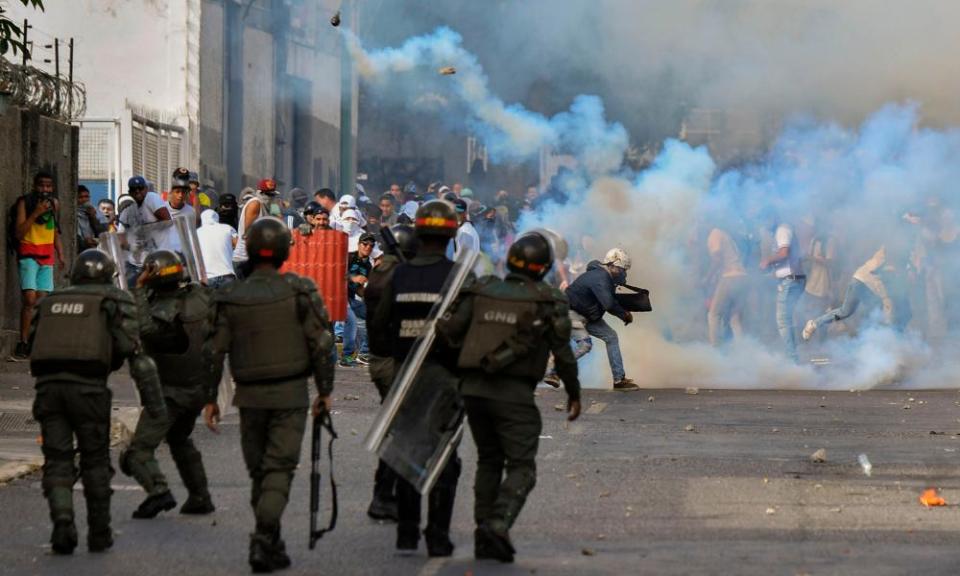 Opposition demonstrators clash with security forces during a protest against the government of Nicolás Maduro in Caracas on Wednesday.