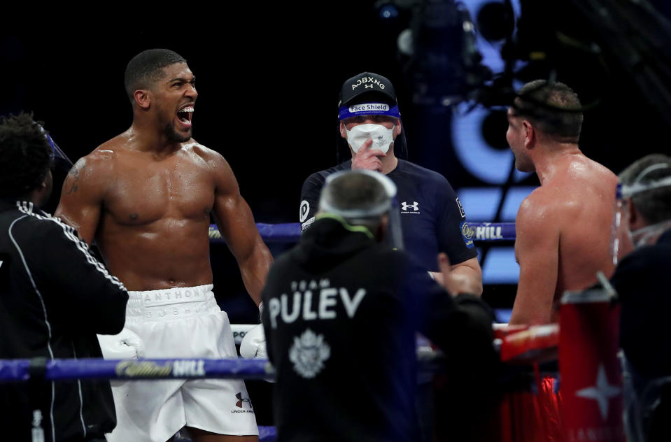 LONDON, ENGLAND - DECEMBER 12: Anthony Joshua reacts to victory over Kubrat Pulev during the IBF, WBA, WBO and IBO World Heayweight Title fight between Anthony Joshua and Kubrat Pulev at The SSE Arena, Wembley on December 12, 2020 in London, England. A limited number of fans (1000) are welcomed back to sporting venues to watch elite sport across England. This was following easing of restrictions on spectators in tiers one and two areas only. (Photo by Andrew Couldridge - Pool/Getty Images)