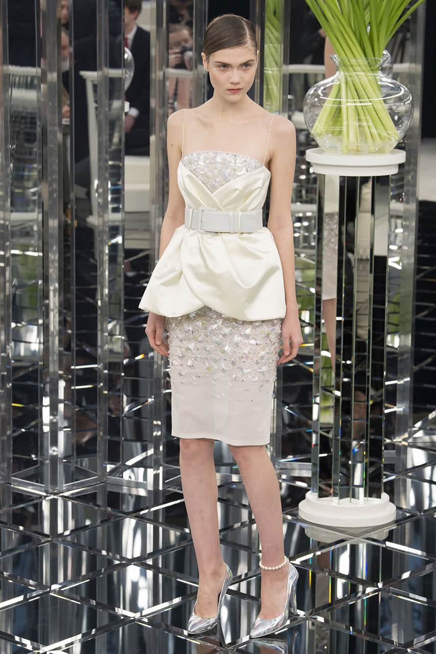 <p>Take a closer look at the scalloped accents on the bustier and the delicate hand-stitched sequins that make this short Chanel cocktail dress one of a kind. (Photo: Getty Images) </p>