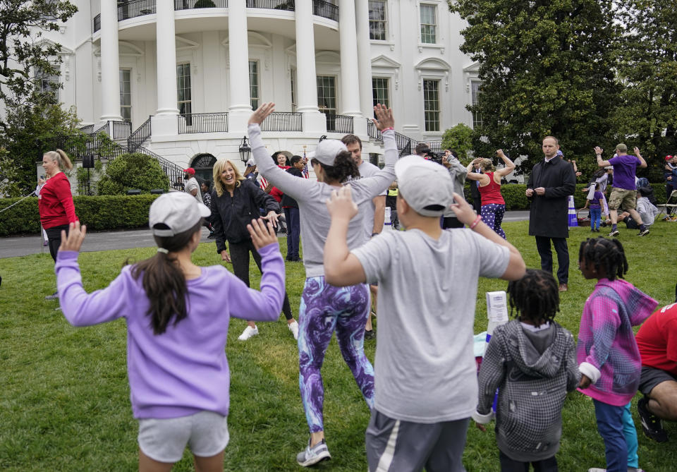 First lady Jill Biden walks though kids and families as they workout during the Joining Forces Military Kids Workout on the South Lawn of the White House in Washington, Saturday, April 29, 2023. The event is in honor of the Month of the Military Child. (AP Photo/Carolyn Kaster)