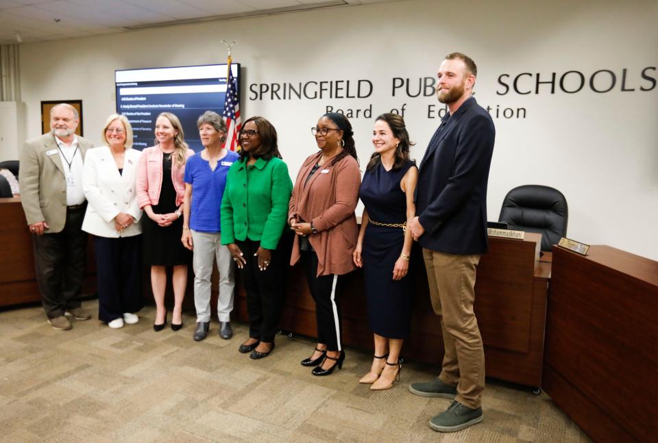 The new Springfield schoolboard poses for a photo before the April 9, 2024 meeting. From left: members Steve Makoski, Judy Brunner, Danielle Kincaid, Susan Provance, Superintendent Grenita Lathan, members Shurita Thomas-Tate, Maryam Mohammadkhani and Kelly Byrne.