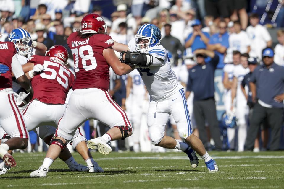 BYU defensive lineman John Nelson (94) charges Dalton Wagner of Arkansas during a game at LaVell Edwards Stadium in Provo on Saturday, Oct. 15, 2022. The Cougars and Razorbacks meet again this week, this time in Fayetteville. | Ben B. Braun, Deseret News