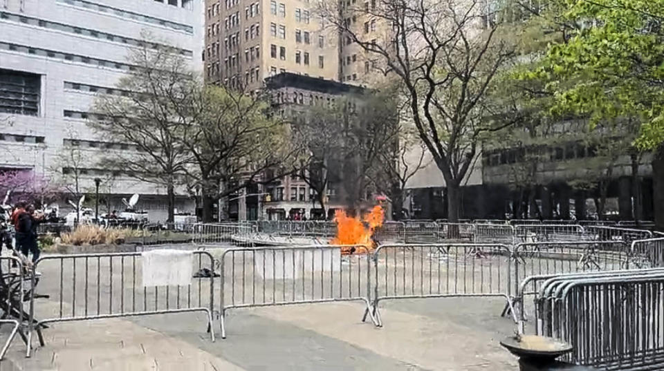 A person set himself on fire near the Manhattan Criminal Court on April 19, 2024 in New York.  (Andrew Bossone/NBC News)