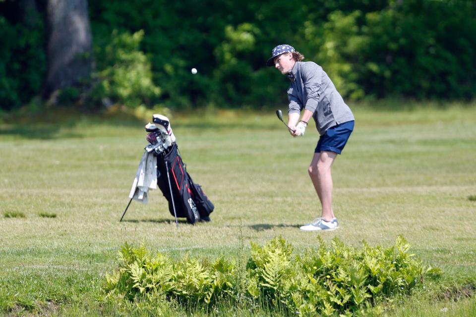 East Greenwich's Brendan Fox hits an approach shot to the par-5 13th hole at Cranston Country Club during Tuesday's first round of the RIIL Golf Championships.