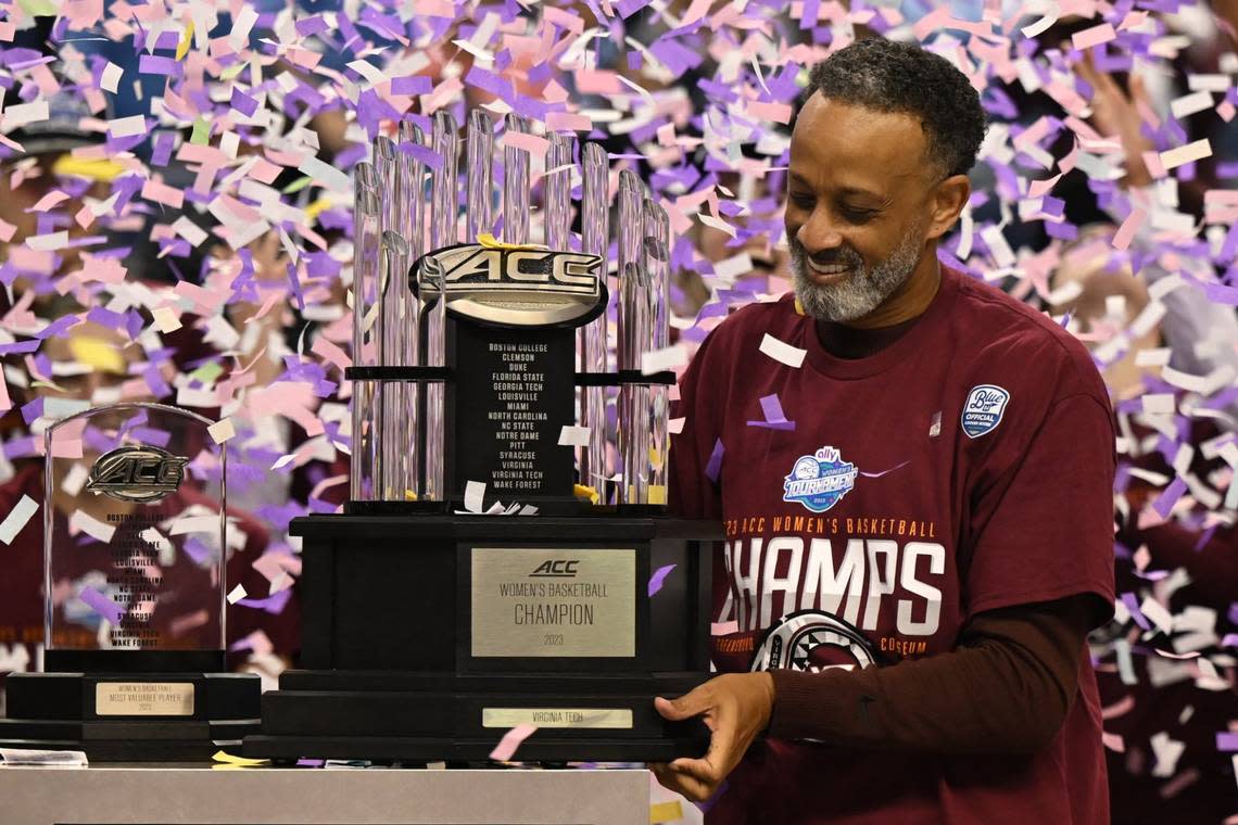 Kenny Brooks holds the championship trophy after his Virginia Tech team won the ACC Tournament championship by defeating Louisville in 2023. Virginia Tech announced Tuesday that Brooks had resigned as Hokies coach to become Kentucky women’s basketball coach. William Howard/USA TODAY NETWORK