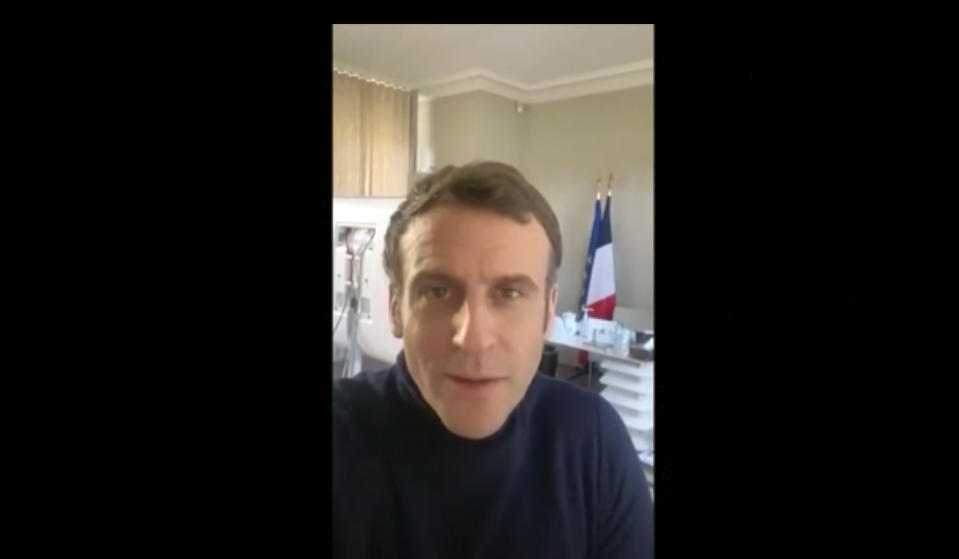 In this image made from video taken from the Twitter account of Emmanuel Macron on Friday, Dec. 18, 2020, French President Emmanuel Macron speaks from his residence in Versailles, France. French President Emmanuel Macron has blamed his COVID-19 on a combination of negligence and bad luck. In what looked like a self-shot video from the presidential retreat in Versailles where he is isolating, Macron said he was experiencing symptoms that included headaches, fatigue and a dry cough. He promised to give daily updates and be “totally transparent” about the evolution of his illness. (@EmmanuelMacron via AP)