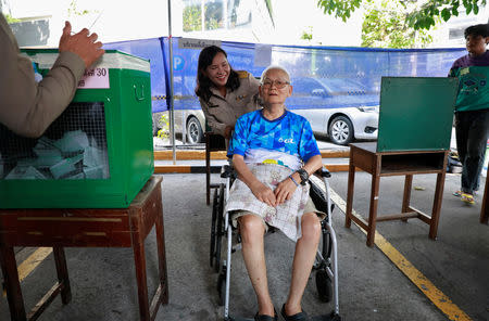 A voter arrives to cast their ballot in the general election at a polling station in Bangkok, Thailand, March 24, 2019. REUTERS/Soe Zeya Tun