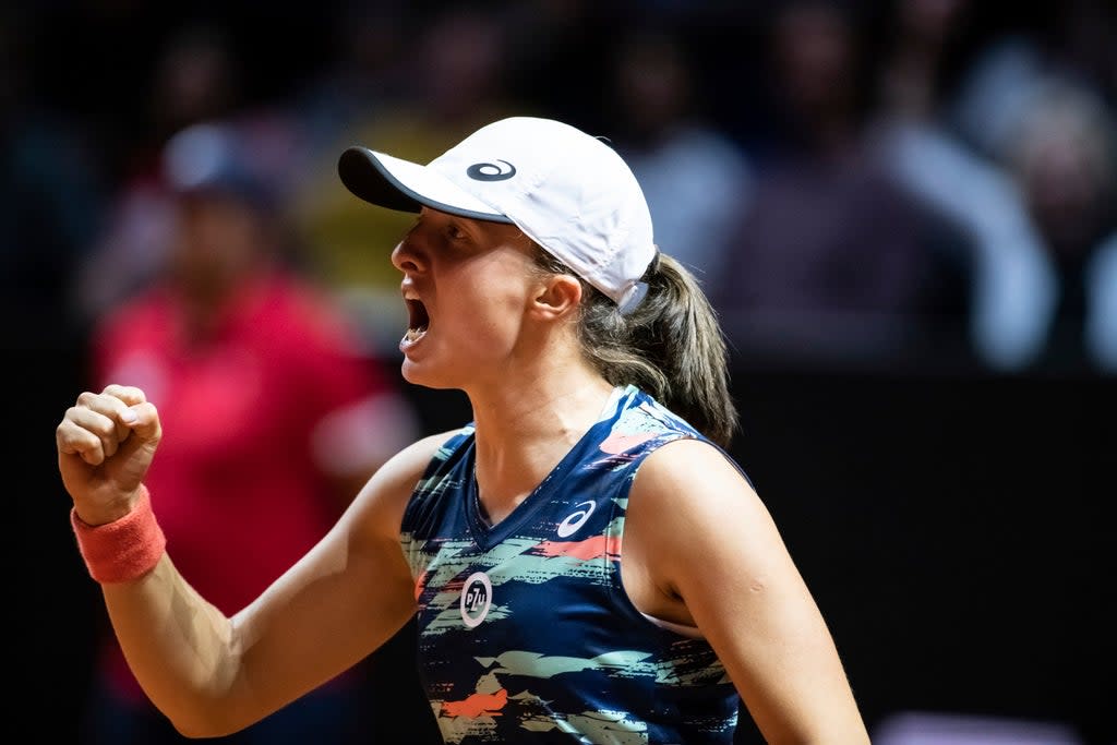 Iga Swiatek won a 23rd match in a row to claim the title in Stuttgart (Silas Stein/dpa via AP) (AP)