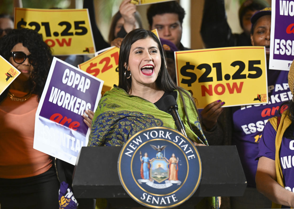 New York Sen. Jessica Ramos, D-East Elmhurst, stands with protesters urging lawmakers to raise New York's minimum wage during a rally at the state Capitol, Monday, March 13, 2023, in Albany, N.Y. (AP Photo/Hans Pennink)
