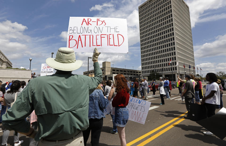 <p>Several hundred students, parents, concerned citizens and anti-gun advocates rally by a plaza connecting state offices in downtown Jackson, Miss. for the “March for Our Lives” rally. (AP Photo/Rogelio V. Solis) </p>