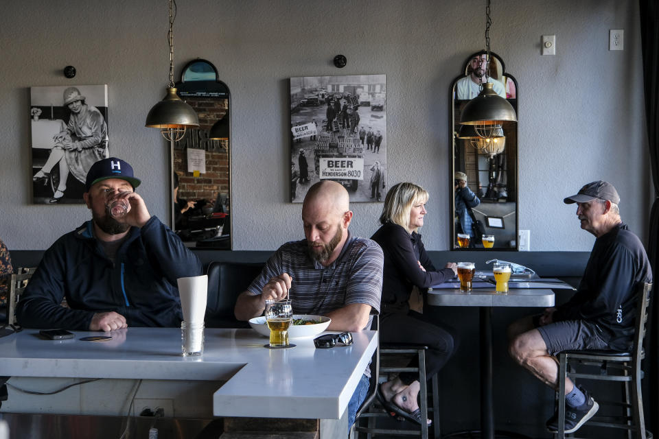 Patrons dine at Notorious Burgers restaurant in Carlsbad, Calif., on Friday, Dec. 18, 2020. (AP Photo/Ringo H.W. Chiu)