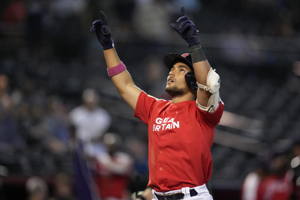 Great Britain's Harry Ford celebrates after hitting a solo home run against Colombia during the seventh inning of a World Baseball Classic game in Phoenix, Monday, March 13, 2023. (AP Photo/Godofredo A. Vásquez)