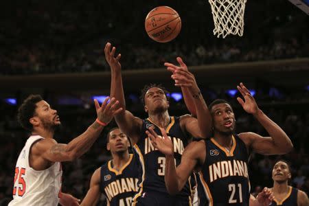 Dec 20, 2016; New York, NY, USA; Indiana Pacers center Myles Turner (33) and forward Thaddeus Young (21) battle for a rebound with New York Knicks guard Derrick Rose (25) during the second half at Madison Square Garden. Mandatory Credit: Adam Hunger-USA TODAY Sports
