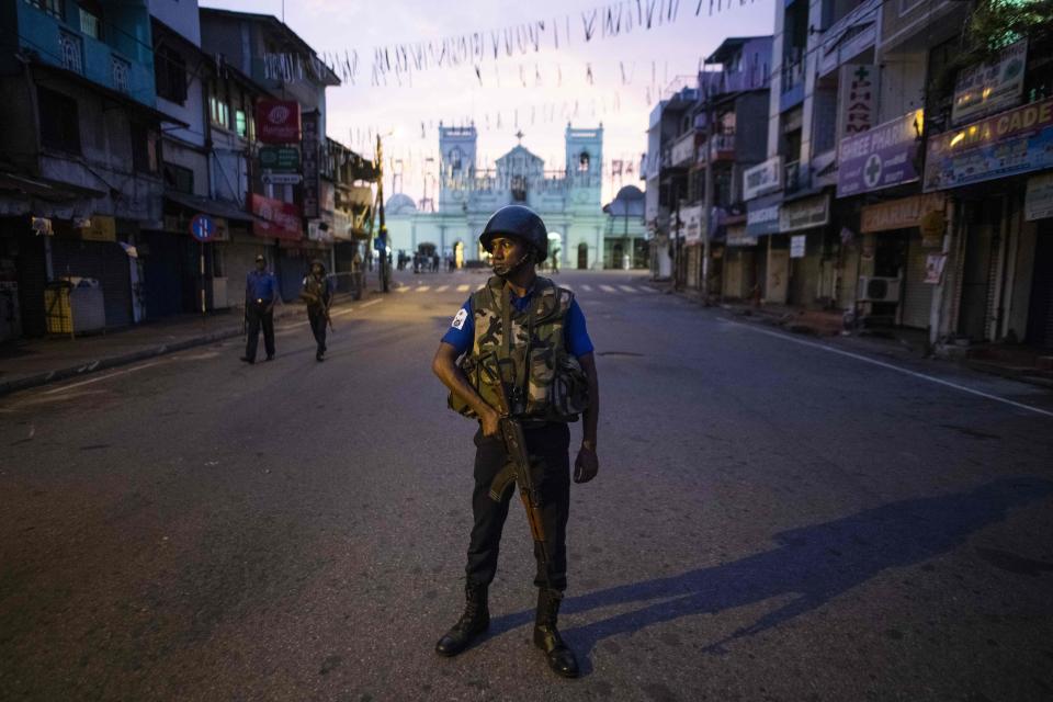 A soldier stands guard St. Anthony's Shrine in Colombo on April 26, 2019, following a series of bomb blasts targeting churches and luxury hotels on Easter Sunday in Sri Lanka. - Authorities in Sri Lanka on April 25 lowered the death toll in a spate of Easter bombings by more than 100 to 253, admitting some of the badly mutilated bodies had been erroneously double-counted. (Photo by Jewel SAMAD / AFP)        (Photo credit should read JEWEL SAMAD/AFP/Getty Images)