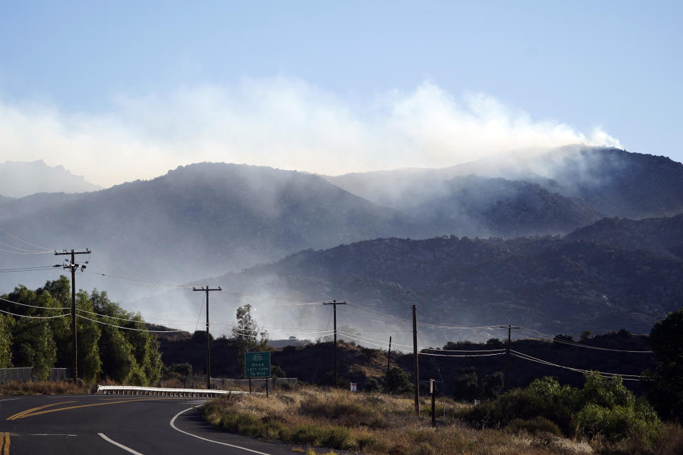 Hills smolder after the Highland Fire passed through, Tuesday, Oct. 31, 2023, in Aguanga, Calif. (AP Photo/Marcio Jose Sanchez)