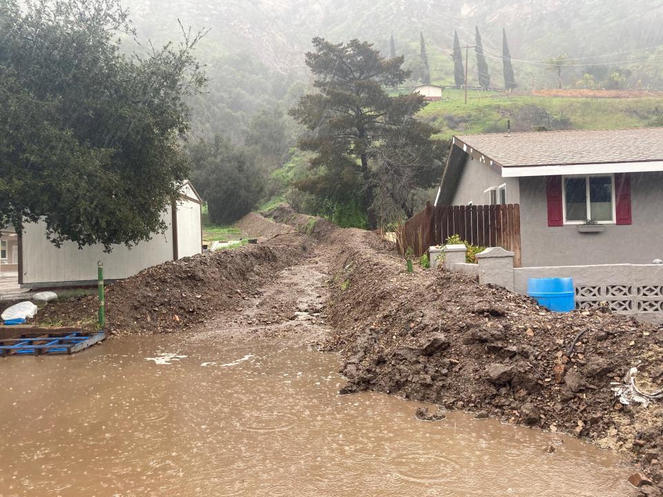 Water flows down a channel along Nye Road near Casitas Springs Friday morning, Feb. 24, 2023, as a storm moves into Ventura County.