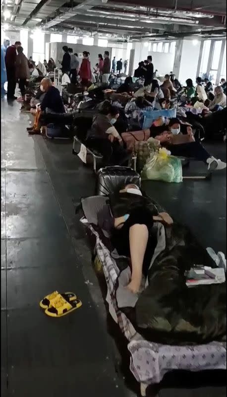 People rest at a quarantine centre near Linkong Skate Park in Changning District, Shanghai