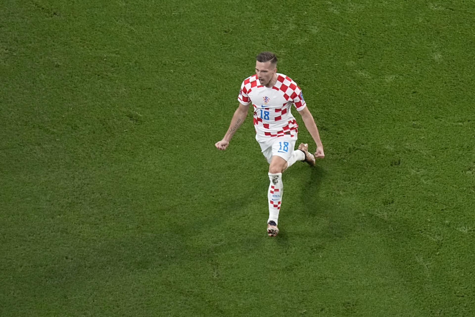 Croatia's Mislav Orsic celebrates after scoring his side's second goal during the World Cup third-place playoff soccer match between Croatia and Morocco at Khalifa International Stadium in Doha, Qatar, Saturday, Dec. 17, 2022. (AP Photo/Pavel Golovkin)