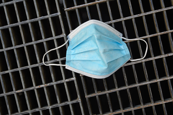 A used face mask is seen in Midtown as the city moves into Phase 3 of re-opening following restrictions imposed to curb the coronavirus pandemic in New York City. 