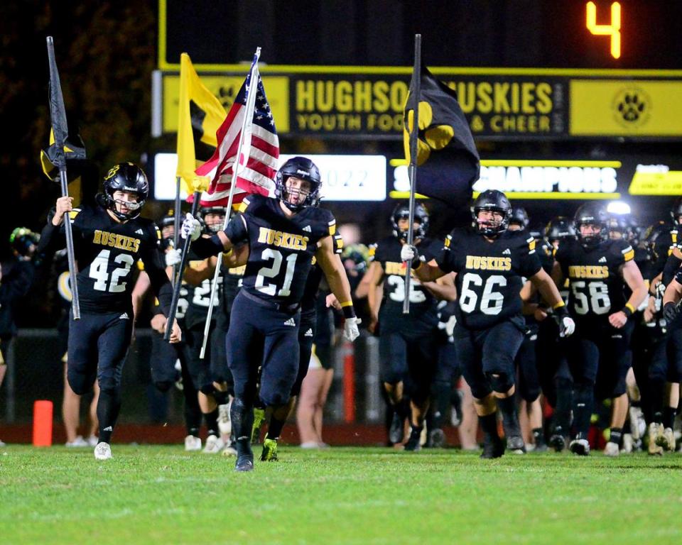 The Hughson High School football team takes the field before a 2023 CIF Division 4-A Northern California Bowl game between Hughson and Palma at Hughson High School in Hughson, Calif. on Saturday, Dec. 2, 2023. Palma won the game 31-21.