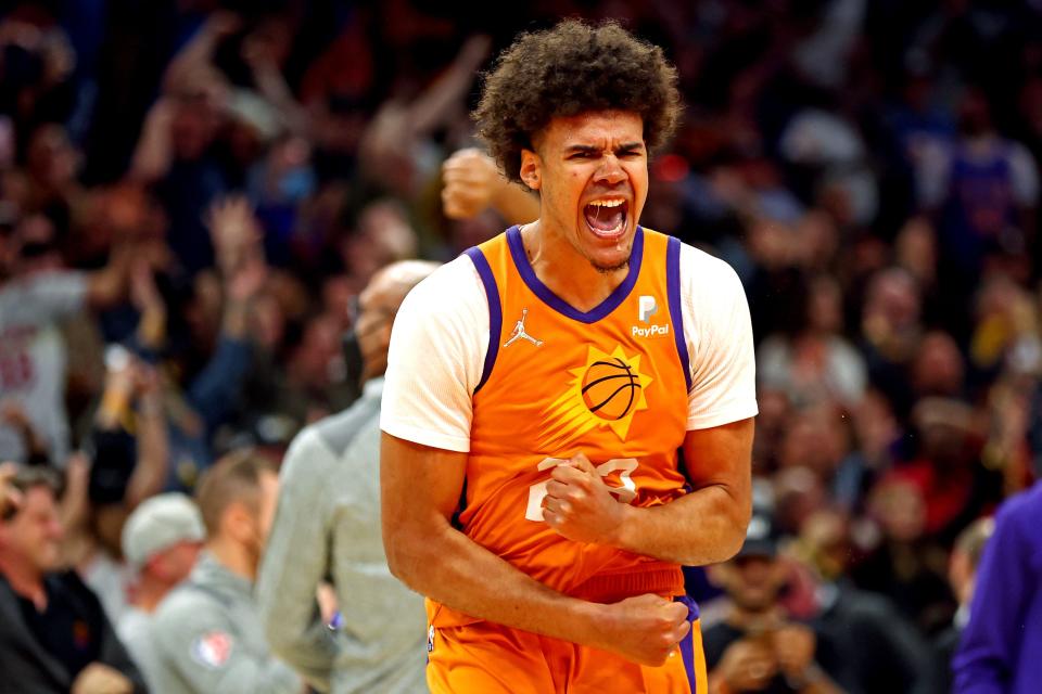 Phoenix Suns forward Cameron Johnson (23) celebrates after hitting the game winning shot at the buzzer against the New York Knicks at Footprint Center.