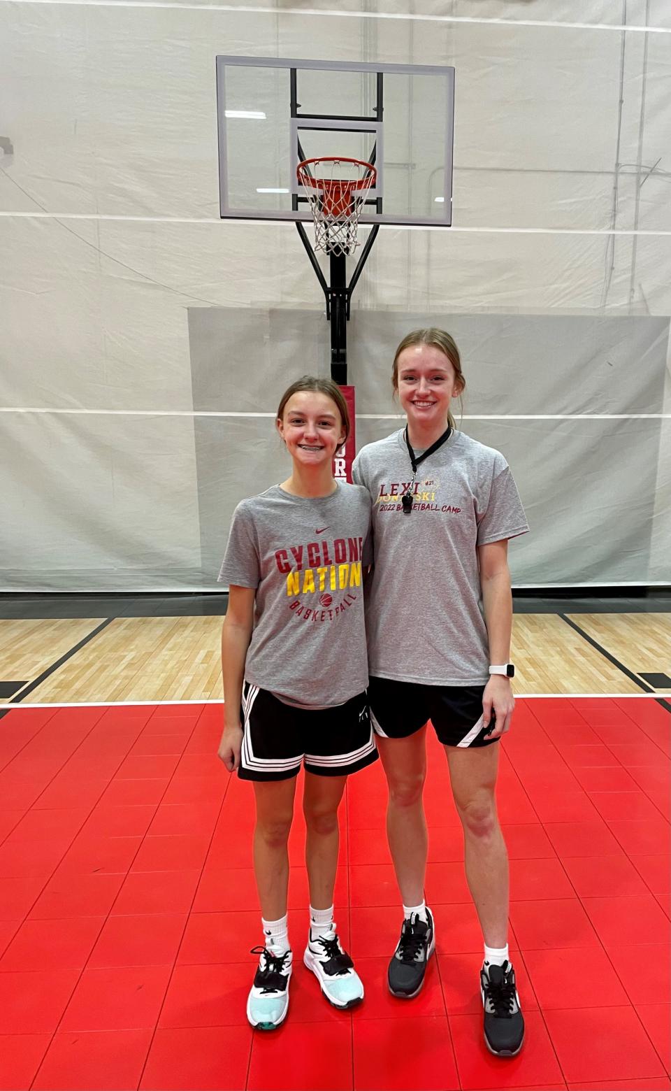 Mia Schwieso, left, of Harlan attended Iowa State guard Lexi Donarski's basketball camp.