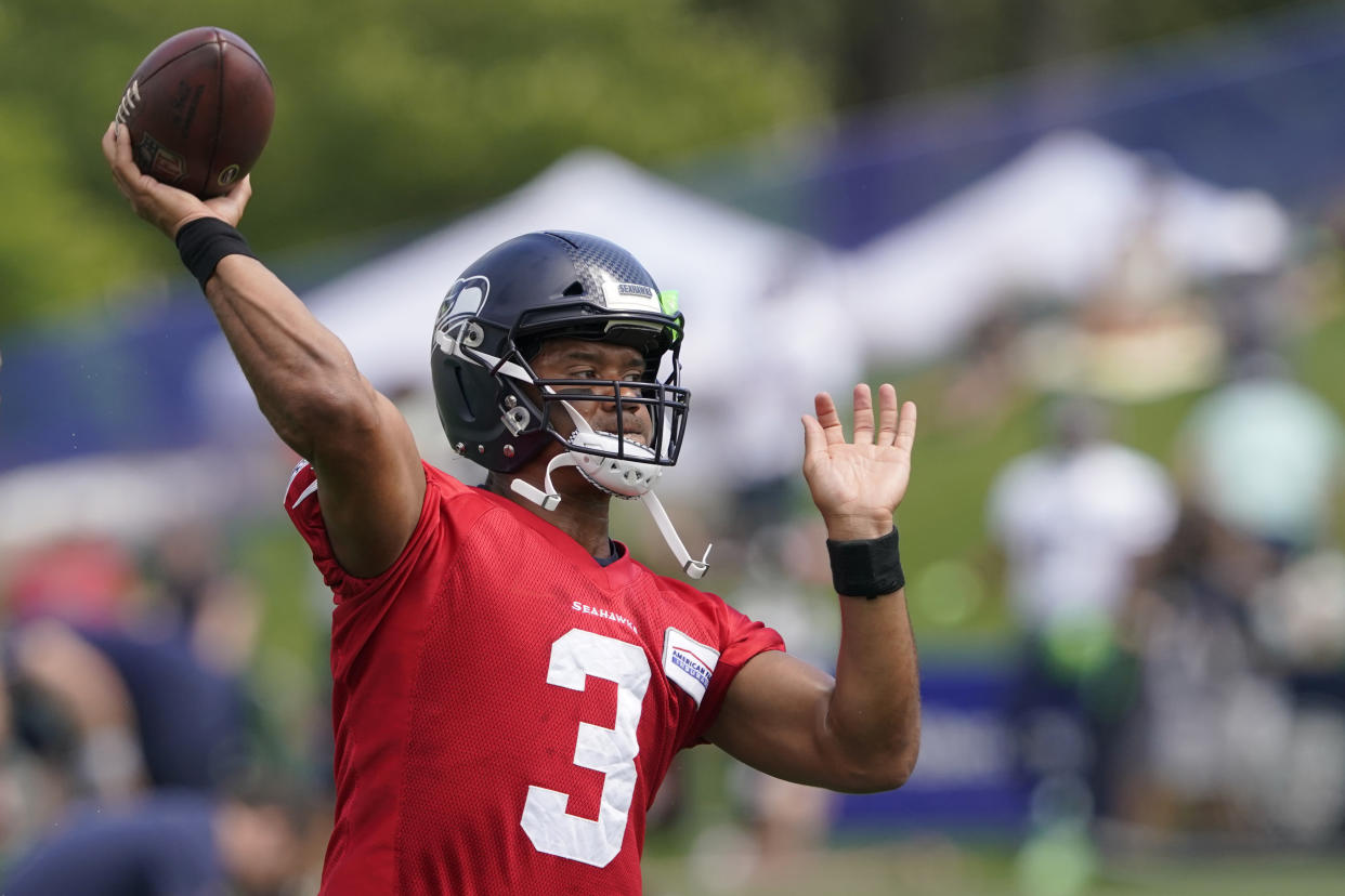 Seattle Seahawks quarterback Russell Wilson passes during NFL football practice Wednesday, July 28, 2021, in Renton, Wash. (AP Photo/Ted S. Warren)