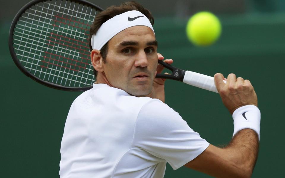 Federer's gorgeous forehand - Credit: AP Photo/Tim Ireland