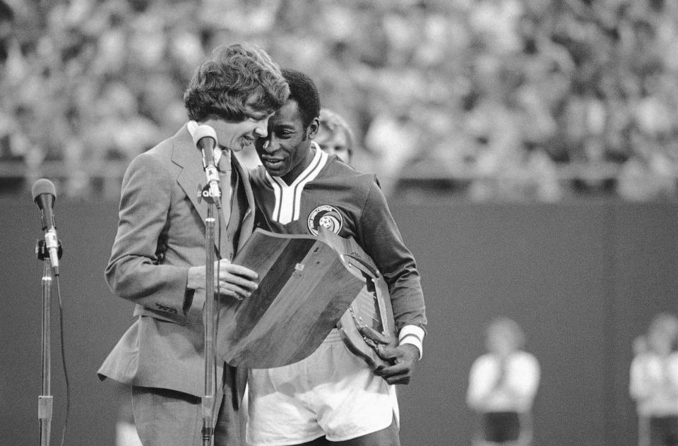 PHOTO: Jeff Carter, son of President Jimmy Carter, gives Pele a plaque thanking Pele for his contributions while playing for the New York Cosmos during ceremonies before Pele's last game, Oct. 1, 1977 at Giant Stadium in East Rutherford, N.J. (Red/AP)