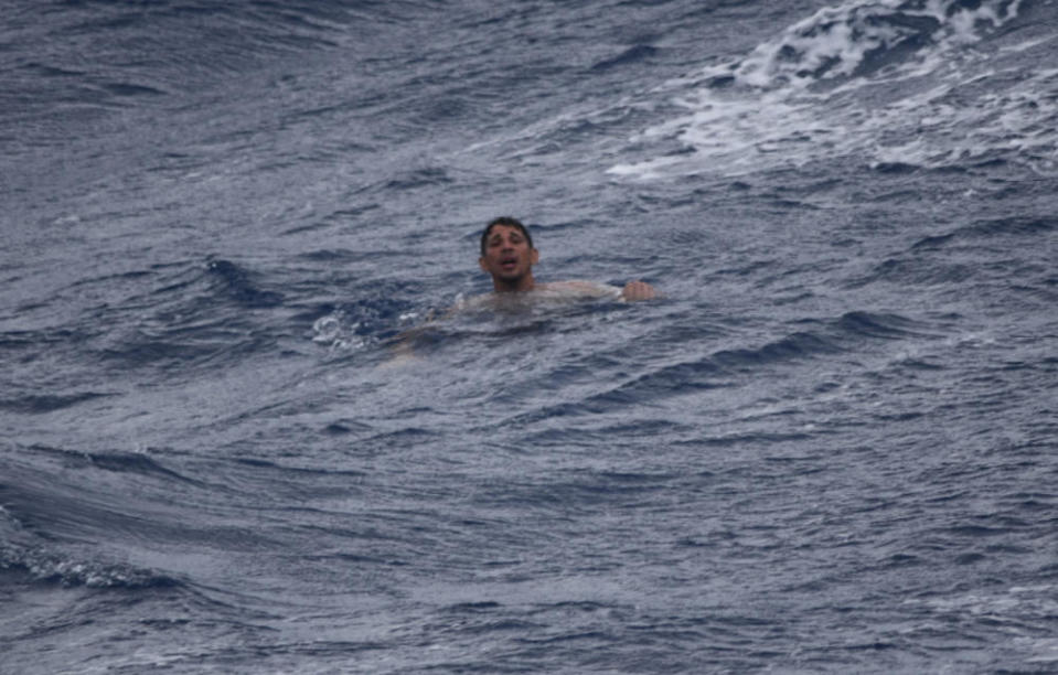 A man treads water and awaits rescue crews approximately 32 miles southeast of Key West, Florida, July 7, 2021.  / Credit: U.S. Coast Guard photo by Coast Guard Cutter Thetis crew