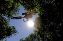 FILE - Chris Deharo takes to the air as he jumps a dirt ramp at a bike park, Friday, May 6, 2016, in Austin, Texas. Considered the most pro-cycling large city in the U.S. South, Austin doubled its network of protected on-street bike lanes to around 60 miles in the first two years of COVID. From 2010 to 2019, the city had tripled its network of conventional on-street bicycle lanes, to nearly 300 miles. (AP Photo/Eric Gay, File)