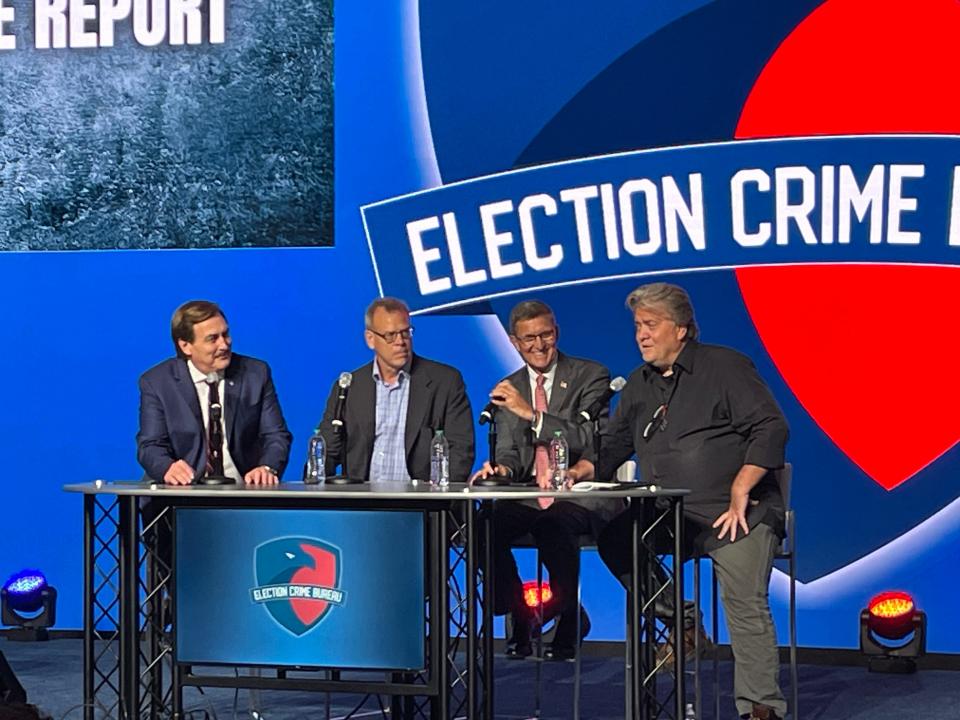 Mike Lindell speaks on a panel with Kurt Olsen, retired lieutenant general Michael Flynn and Steve Bannon at the Mike Lindell Election Crime Bureau Summit on Aug. 16, 2023 in Springfield, MO.