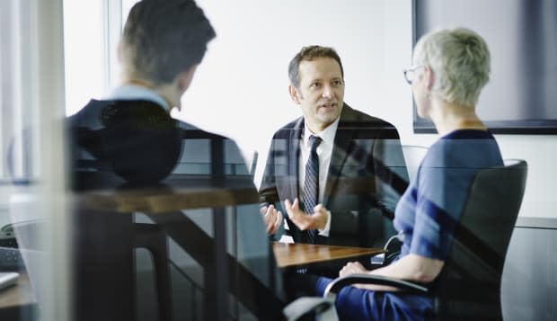 Businessman leading discussion with colleagues